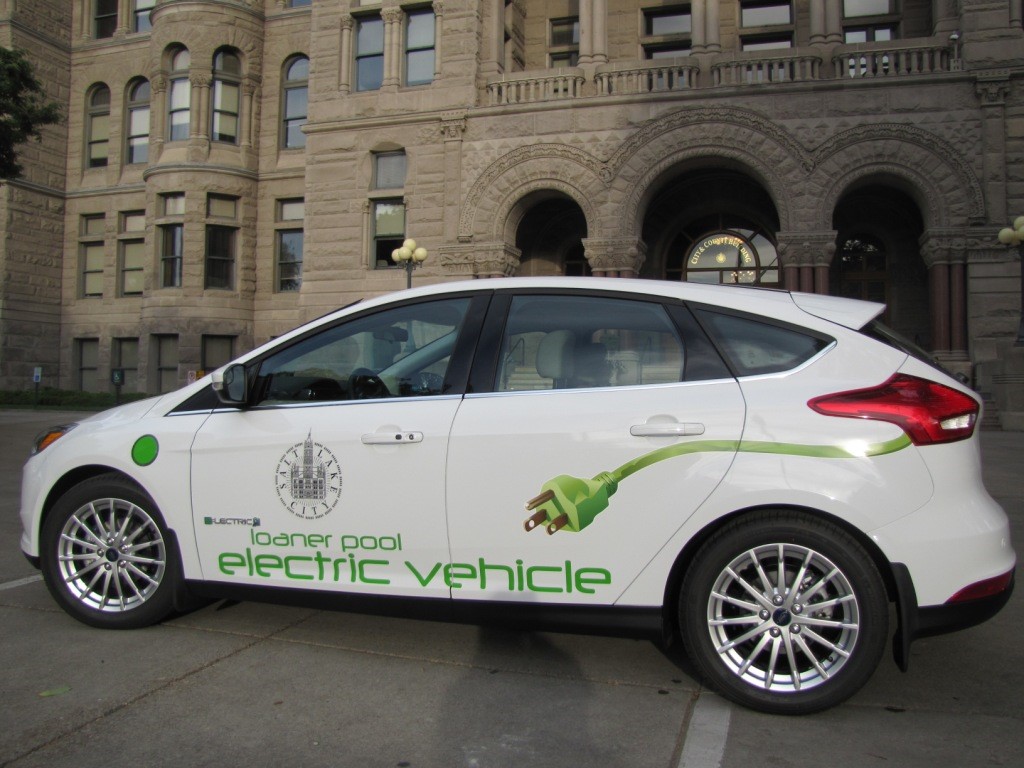 Salt Lake City loaner pool electric vehicle parked outside city and county building.