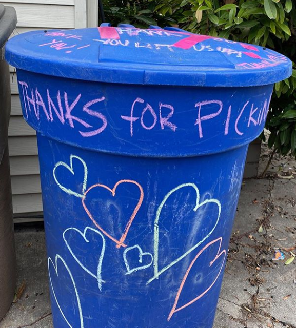 Photo of SLC recycling bin with chalk decorations reading "Thanks for picking up" and different hearts.