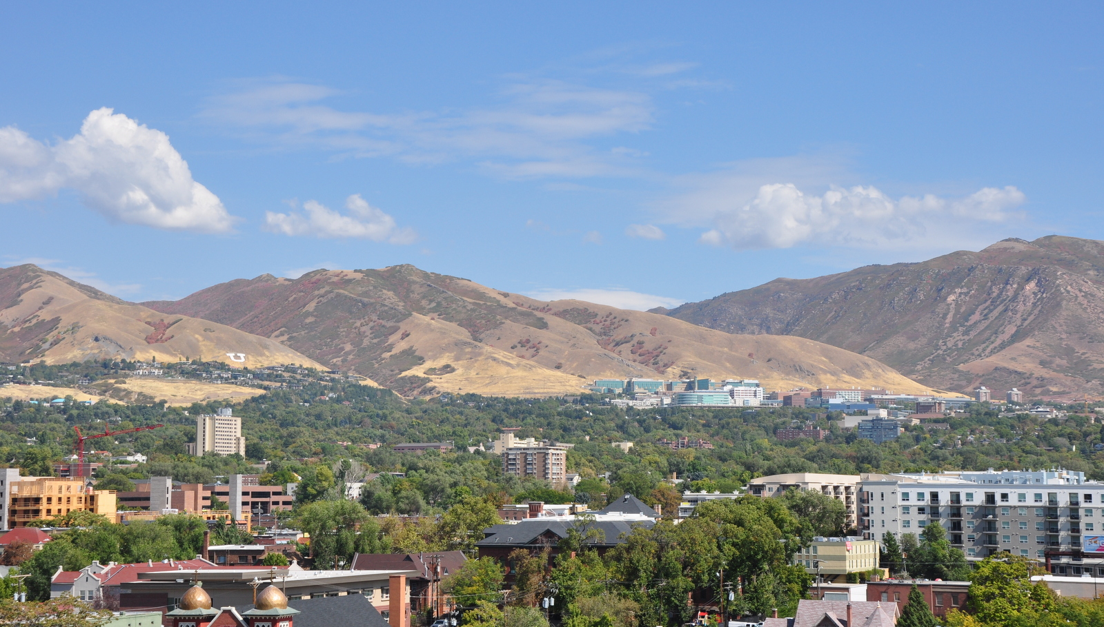 Photo of Salt Lake City looking towards east-bench foothills on sunny day.