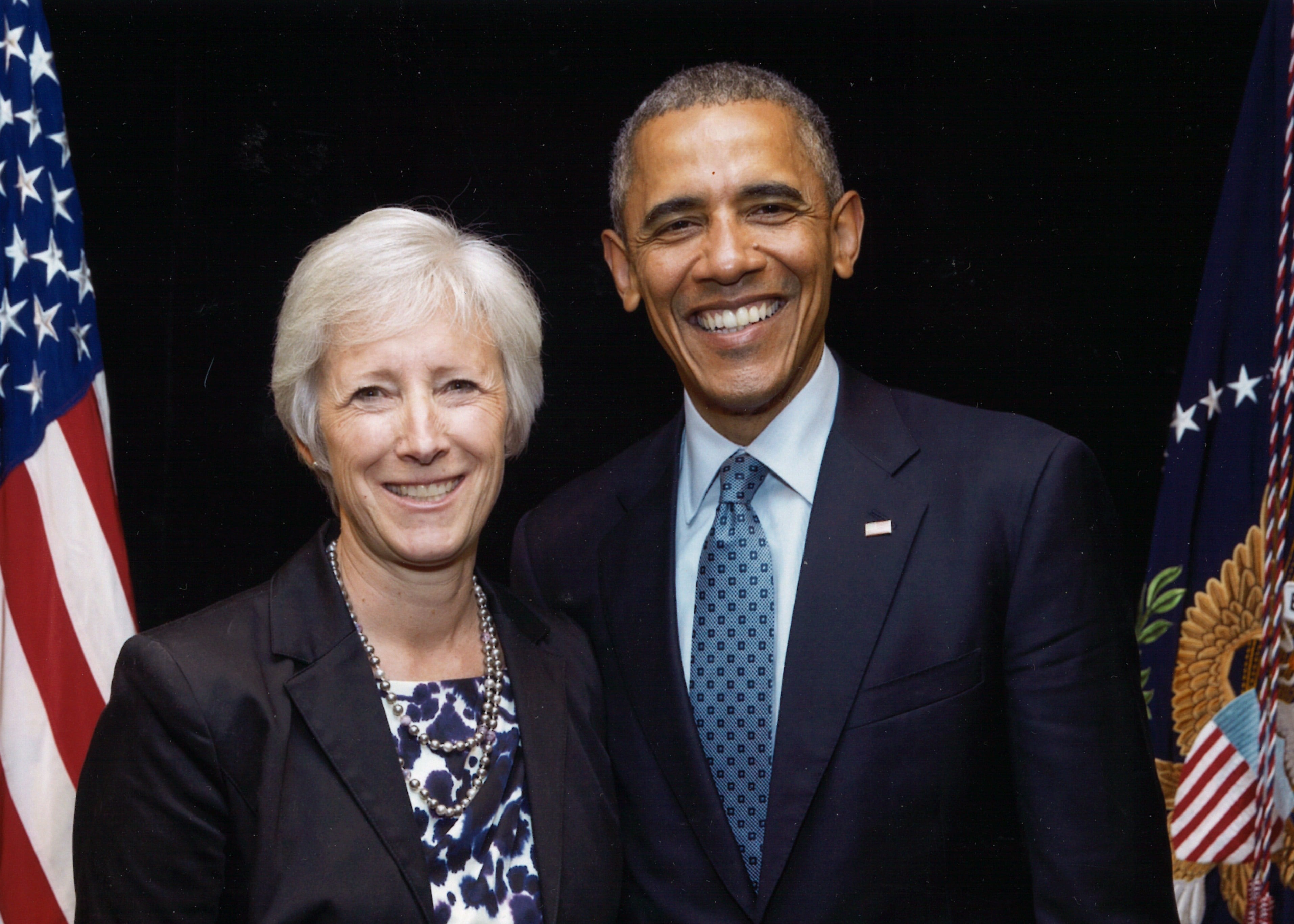 Photo of Vicki Bennett with President Barack Obama. 